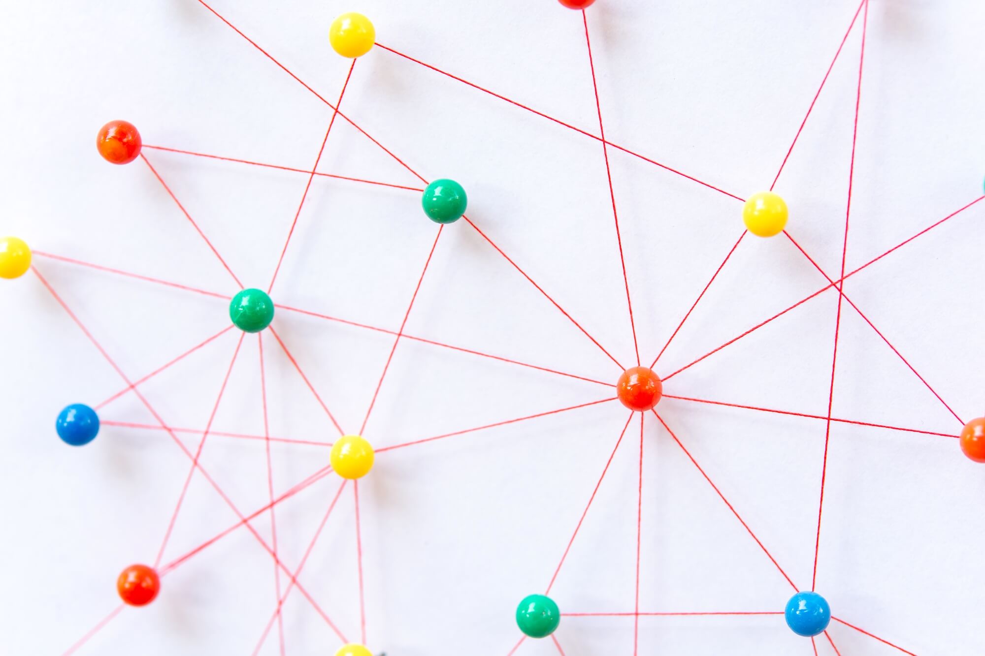 connection between the two networks. Network simulation on paper linked together by yarn